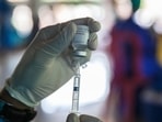 A healthcare worker fills a syringe with a dose of the AstraZeneca Covid-19 vaccine.(Bloomberg) A healthcare worker fills a syringe with a dose of the AstraZeneca Covid-19 vaccine.(Bloomberg)