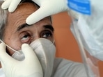 A doctor examines a Covid-19 patient for black fungus infection. (PTI)