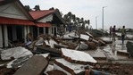 People walk through a damaged shoreline in West Bengal after Cyclone Yaas hit India's eastern coast.(AFP Photo) People walk through a damaged shoreline in West Bengal after Cyclone Yaas hit India's eastern coast.(AFP Photo)