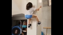 Arat Hosseini attempting to climb a pole