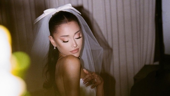 The beautiful veil with a bow perched on top of her perfect hairdo gave the Audrey Hepburn vibe Ariana wanted to go for. (Instagram)