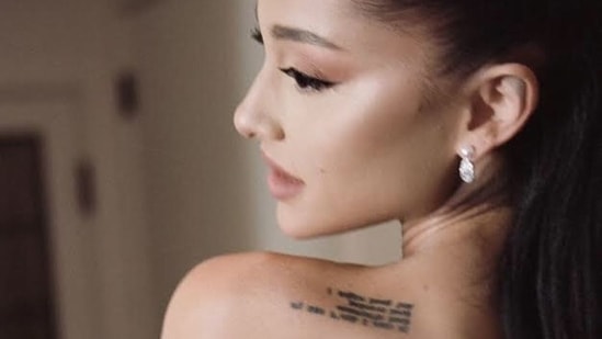 Ariana kept her wedding look minimal, sporting her usual winged eye and nude make-up look with her high ponytail.(Instagram)