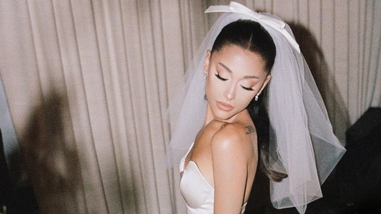 Ariana's dress was by ace wedding dress designer Vera Wang, the dress had a white sweetheart neck, low cut back and a long slit to show off the stunners legs. (Instagram)
