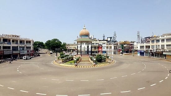 Mysuru has been reporting above 2,000 new cases daily for the past week. In picture - A deserted road crossing during the weekend lockdown in Mysuru.(ANI)