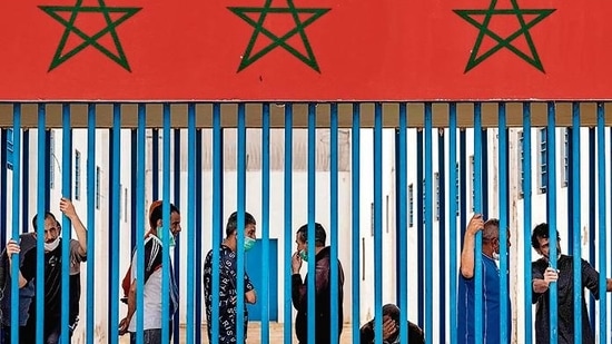 Prisoners wait for their turn to receive a dose of the AstraZeneca jab against the coronavirus, during a vaccination campaign at the El-Arjate prison near the capital Rabat.(AFP) Prisoners wait for their turn to receive a dose of the AstraZeneca jab against the coronavirus, during a vaccination campaign at the El-Arjate prison near the capital Rabat.(AFP)