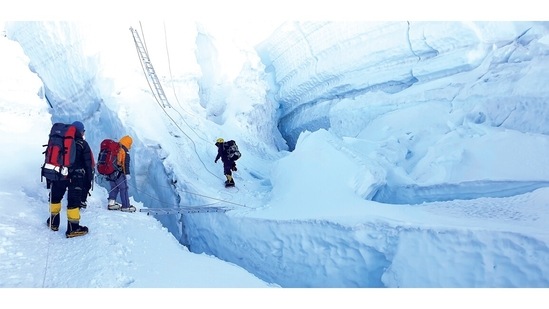 The last horizontal ladder on the Khumbu Icefall at approx. 19000ft. the Everest demands and teaches several things. The “power of focus” is one of them. The ability to focus so sharply on what needs to be done, that one does not even see the “problems” is a useful talent in life and on Everest. You HAVE to focus sharply on the rung to place your foot and not worry about the crevasse below and not be scared on the wobbly ladder. No guts, no glory – this theme comes alive every few minutes on the Khumbu!(Aditya Gupta)