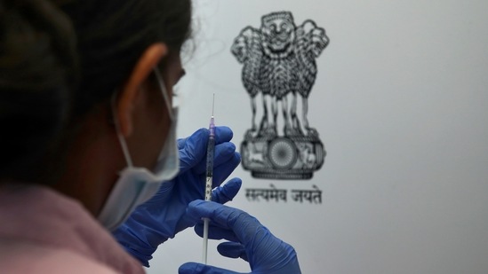 A health worker prepares to administer the Sputnik V coronavirus vaccine to a man.(AP representative image)