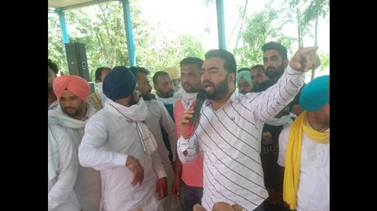 Gangster-turned-activist Lakha Sidhana addressing a gathering at Mehlan Chowk village of Sangrur district on Thursday.