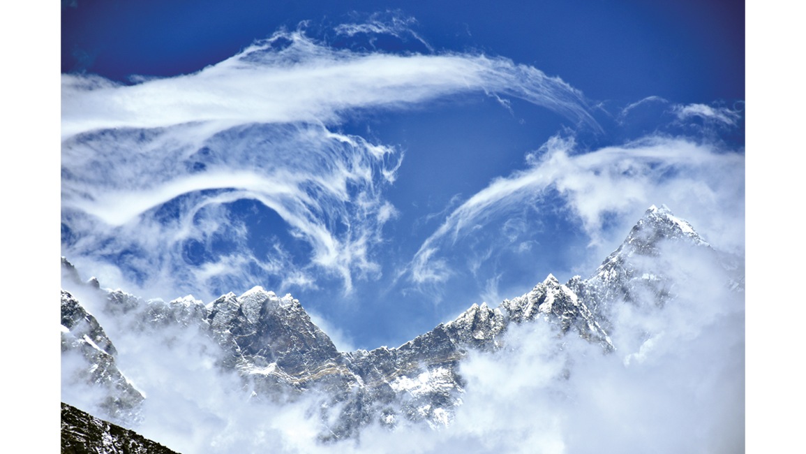 Cloud art by the Himalayas.