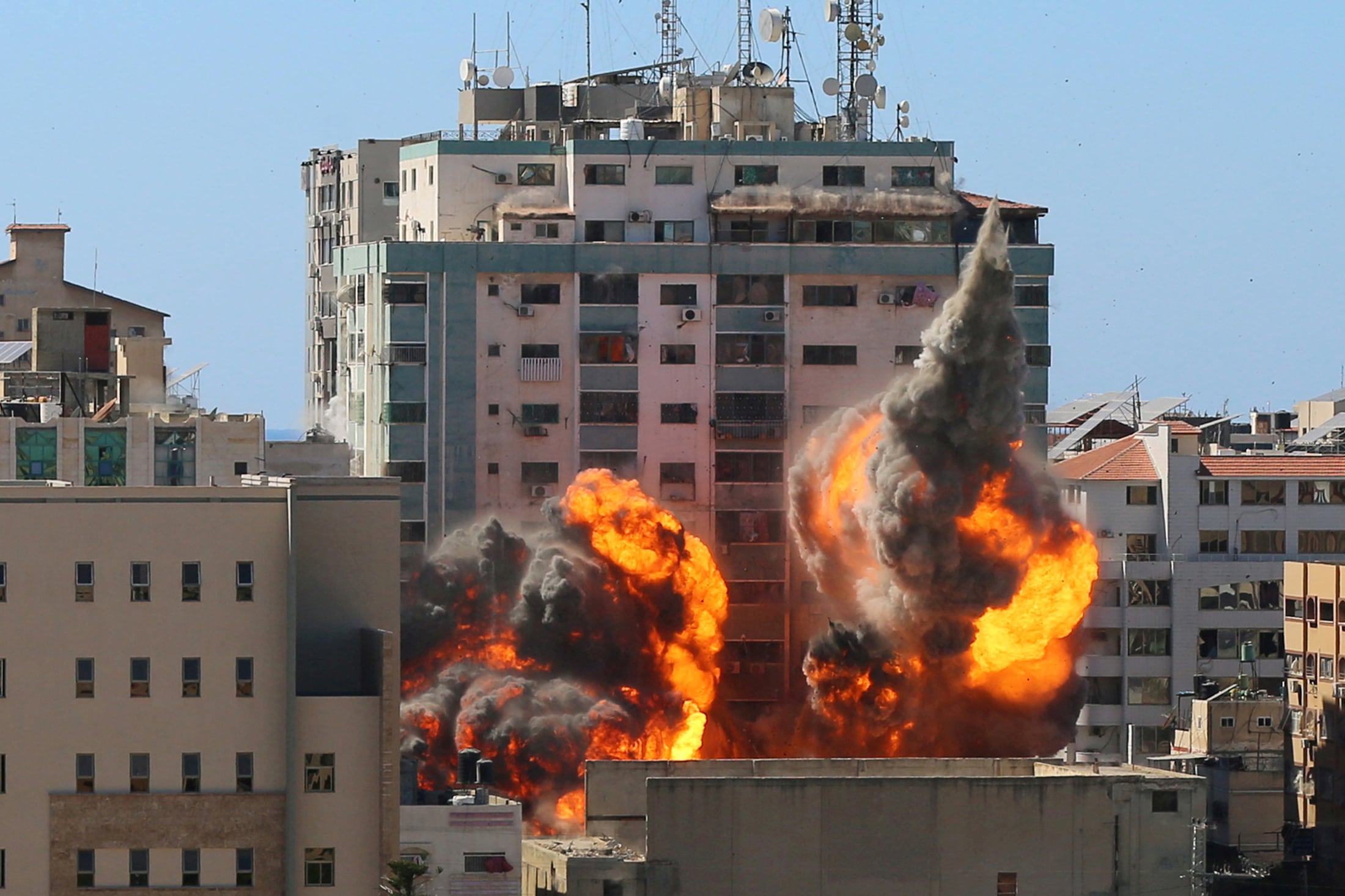 The al-Jalaa building housing Associated Press (AP) and Al Jazeera media offices is hit by an Israeli air strike in Gaza City on May 15, 2021. (REUTERS) The al-Jalaa building housing Associated Press (AP) and Al Jazeera media offices is hit by an Israeli air strike in Gaza City on May 15, 2021. (REUTERS)
