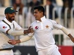 Pakistan pacer Naseem Shah, right, celebrates with teammate Shan Masood(AP)