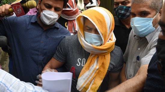 Olympic wrestler Sushil Kumar and his associate Ajay Kumar (back) in the custody of Delhi Police Special cell in New Delhi, India, on Sunday, May 23, 2021. (Photo by Arvind Yadav/ Hindustan Times)