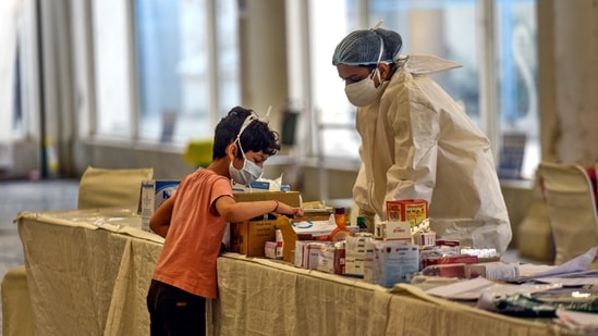 A child browses through medicines at the Covid-19 Care centre setup in Rakab Ganj Gurudwara, New Delhi. (Sanchit Khanna/HT PHOTO) A child browses through medicines at the Covid-19 Care centre setup in Rakab Ganj Gurudwara, New Delhi. (Sanchit Khanna/HT PHOTO)