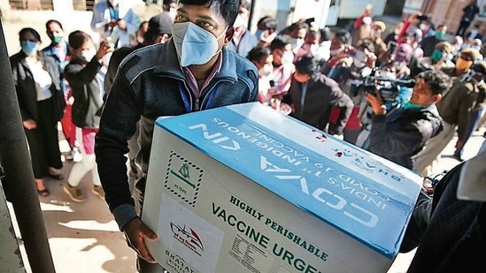 A health worker carries the first consignment of 1,000 vials of Covaxin, at a vaccine centre in Jaipur on January 13. (Himanshu Vyas/HT Photo) A health worker carries the first consignment of 1,000 vials of Covaxin, at a vaccine centre in Jaipur on January 13. (Himanshu Vyas/HT Photo)