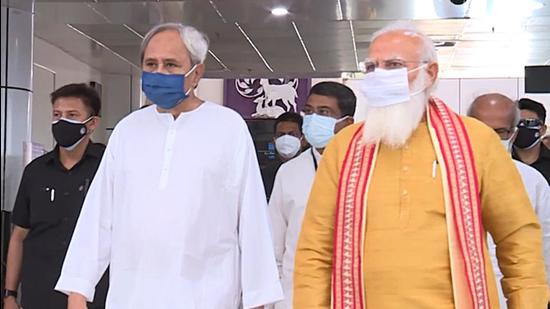 File photo: Odisha chief minister Naveen Patnaik along with Prime Minister Narendra Modi on his arrival in Bhubaneswar on Friday. (ANI)