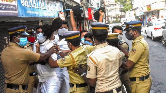 Police attempt to detain Youth Congress workers during a protest against recent rules and regulations brought in by the administrator in Lakshadweep, in Kochi on Thursday, May 27. (PTI)