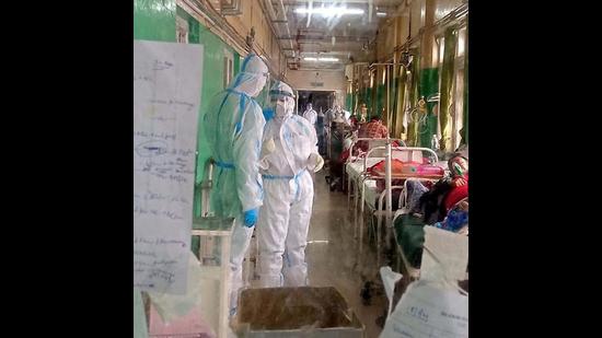 Health workers at a hospital in Shimla earlier this week. During the first Covid wave that lasted from the outbreak in March last year to February 23, 2021, the positivity rate in Himachal Pradesh was 5.48%, while it was 15.73% after that till date (Deepak Sansta/HT) Health workers at a hospital in Shimla earlier this week. During the first Covid wave that lasted from the outbreak in March last year to February 23, 2021, the positivity rate in Himachal Pradesh was 5.48%, while it was 15.73% after that till date (Deepak Sansta/HT)