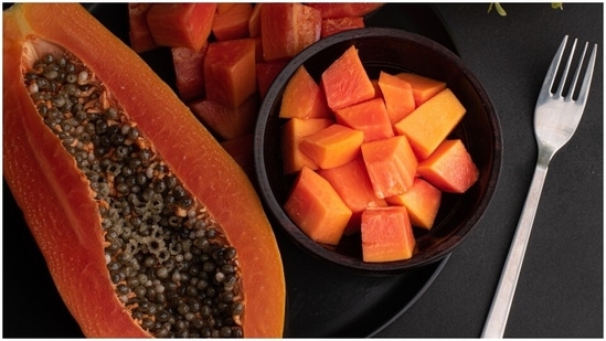 Papaya face mask: Papaya contains carotenoids and papain which not just help fight wrinkles but also act as a great exfoliant. All you need to do is mash one-half papaya in a bowl and apply it evenly on your face and neck. Leave it overnight and wash your face with lukewarm water in the morning. This is a gentle face mask so you can use it thrice a week.(Unsplash)