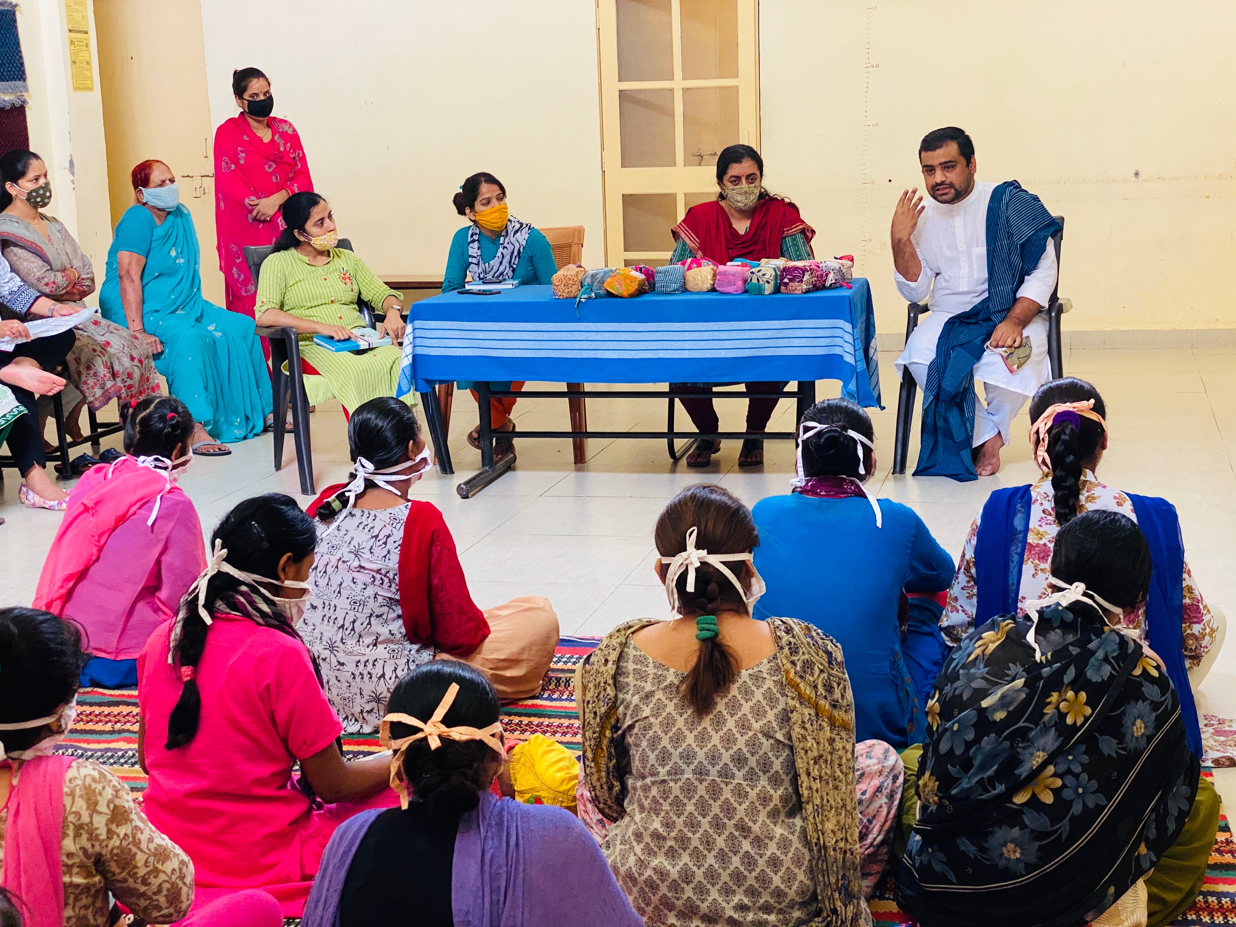 Anurag Chauhan (in white on stage) during a workshop on menstrual hygiene in a rural area. (HT Photo) Anurag Chauhan (in white on stage) during a workshop on menstrual hygiene in a rural area. (HT Photo)