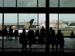 People look at a Singapore Airlines plane, amid the spread of the coronavirus disease (Covid-19), at a viewing gallery of the Changi Airport in Singapore October 12, 2020. (REUTERS)