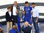 Chelsea's Cesar Azpilicueta celebrates with the trophy and owner Roman Abramovich after winning the Champions League.