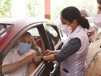 A health worker administers a dose of Covid-19 vaccine during a drive-in vaccination camp, at Chhatrasal Stadium, in New Delhi. A health worker administers a dose of Covid-19 vaccine during a drive-in vaccination camp, at Chhatrasal Stadium, in New Delhi.