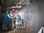 MCD mayor, Jai Prakash along with his workers seen sanitizing the streets as a preventive measure from coronavirus at Anand Parbat in New Delhi, India, on Saturday, May 29, 2021. (Photo by Sanchit Khanna/ Hindustan Times) MCD mayor, Jai Prakash along with his workers seen sanitizing the streets as a preventive measure from coronavirus at Anand Parbat in New Delhi, India, on Saturday, May 29, 2021. (Photo by Sanchit Khanna/ Hindustan Times)