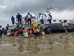 Indian Coast Guard personnel carry out rescue and relief works during landfall process of Cyclone Yaas in Odisha, Wednesday, May 26, 2021. (PTI) Indian Coast Guard personnel carry out rescue and relief works during landfall process of Cyclone Yaas in Odisha, Wednesday, May 26, 2021. (PTI)