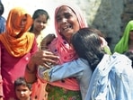 Family members mourn after more people died after allegedly consuming spurious liquor sold by a licensed vendor in Aligarh district.(PTI) Family members mourn after more people died after allegedly consuming spurious liquor sold by a licensed vendor in Aligarh district.(PTI)