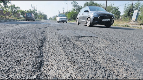 A dilapidated road in Sector 51, Chandigarh. The civic body manages a road network of around 1,400 kilometres, among which the V-6 roads (access roads to houses) are in the worst condition, as per city residents. (Ravi Kumar/HT)