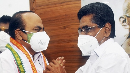 KPCC President Mullapally Ramachandran (R) greets newly appointed opposition leader of Kerala Assembly VD Satheesan, at KPCC office in Thiruvananthapuram. (PTI Photo)