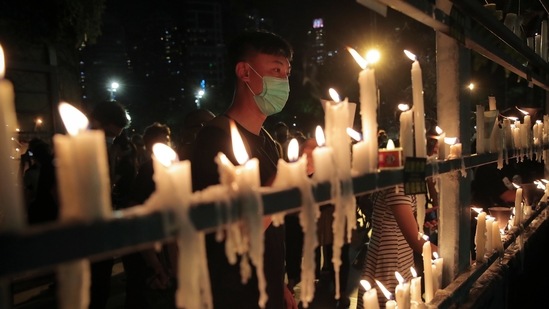 Samuel Chu, who runs the Hong Kong Democracy Council in Washington, retweeted an image of Tsoi making his statement, writing, “We will light a candle for you and all of Hong Kong". (AP Photo/Kin Cheung)(AP)
