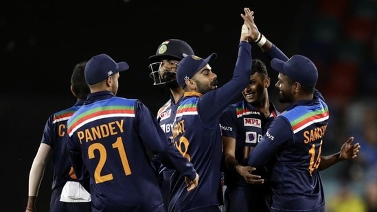 India's Sanju Samson, right, celebrates with teammates after taking a catch to dismiss Australia's Steve Smith during a T20 international cricket match at Manuka Oval, in Canberra, Australia.(AP)