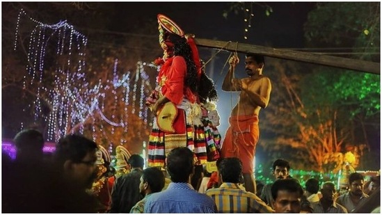 Garudan Thookam: This fascinating ritual is performed in Kerela's Kali temples where dancers deck up as 'Garadu,' the vehicle of Lord Vishnu who quenched the goddess Kali's thirst with the blood of demon Darika. After their performance, they hook themselves from a shaft.(Instagram/harikrishnan.97)