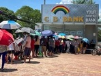 In the country's largest city Yangon, people are forming long lines outside banks every day before dawn, to get cash. 2021. REUTERS/Stringer