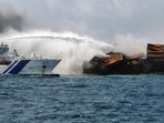 Indian Coast Guard sprays water and foam at high speeds on the blaze on Container Ship MV X-Press Pearl, in Colombo