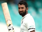 Cheteshwar Pujara raises his bat after a century. (Getty Images) Cheteshwar Pujara raises his bat after a century. (Getty Images)