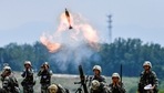 Soldiers of Chinese People's Liberation Army (PLA) fire a mortar during a live-fire military exercise in Anhui province, China. (REUTERS ) Soldiers of Chinese People's Liberation Army (PLA) fire a mortar during a live-fire military exercise in Anhui province, China. (REUTERS )