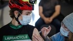 A cyclist receives a dose of the Pfizer-BioNTech Covid-19 vaccine at the Gilles Villeneuve racetrack in Montreal, Quebec, Canada.(Bloomberg) A cyclist receives a dose of the Pfizer-BioNTech Covid-19 vaccine at the Gilles Villeneuve racetrack in Montreal, Quebec, Canada.(Bloomberg)