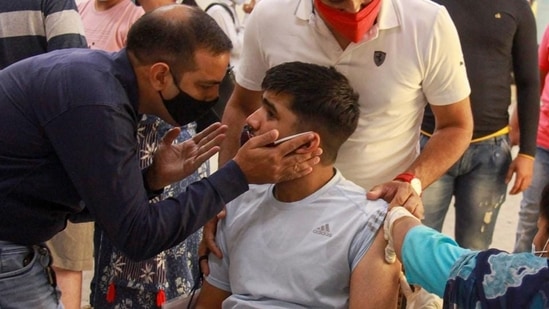 A beneficiary receives a dose of the Covid-19 vaccine during a vaccination drive for specially-abled in Gurugram. (PTI) A beneficiary receives a dose of the Covid-19 vaccine during a vaccination drive for specially-abled in Gurugram. (PTI)