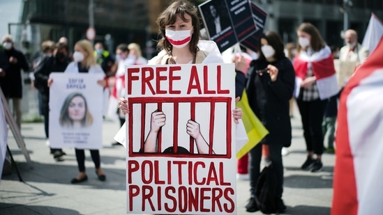 A woman holds a poster during a demonstration demanding the freedom of Belarus opposition activist Raman Protasevich in Berlin.(AP)