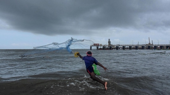 A fisherman does fishing ahead of southwest monsoon at a seaside in Kochi. (PTI Photo) A fisherman does fishing ahead of southwest monsoon at a seaside in Kochi. (PTI Photo)