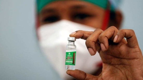 A nurse displays a vial of Covishield, the Covid-19 vaccine being manufactured by the Serum Institute of India, at a medical centre in Mumbai. (File Photo)