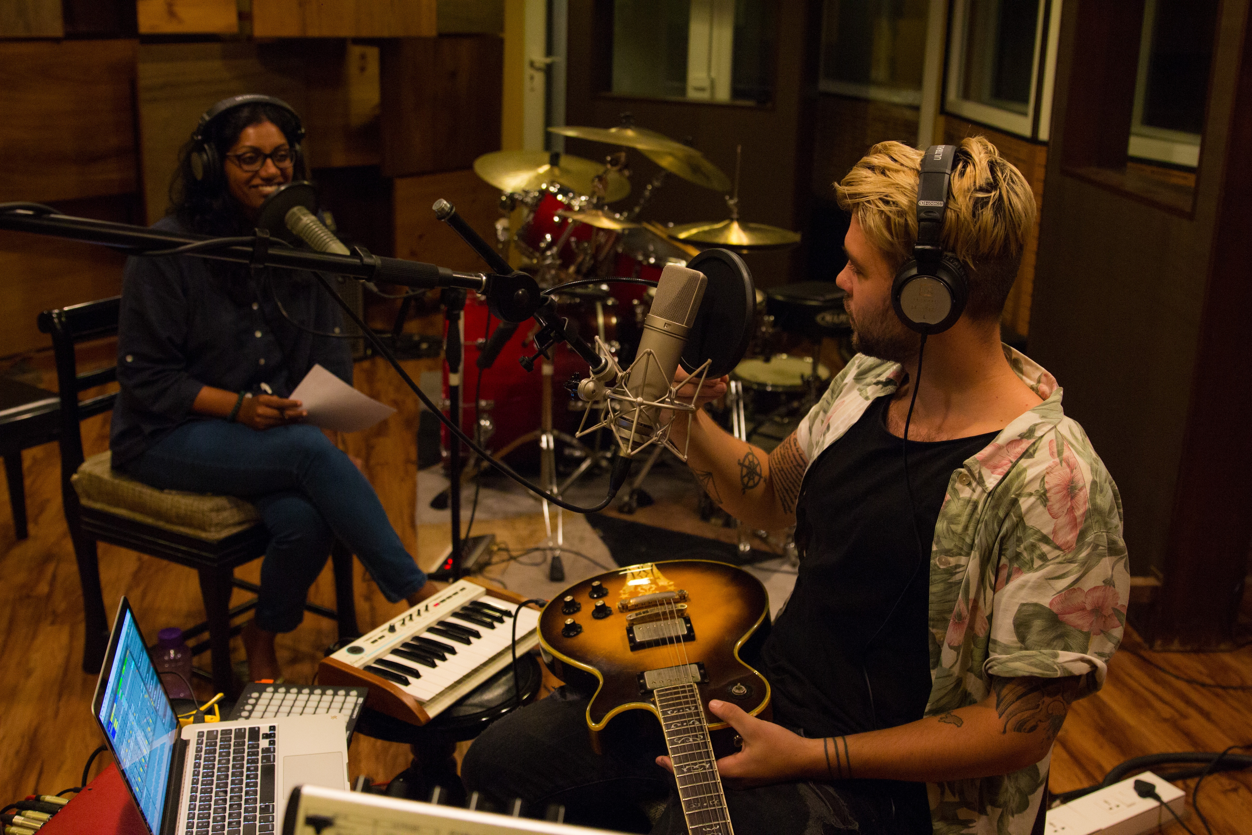 Mae Mariyam Thomas at the studio with indie artist Jordan Johnson, recording episode 143 of Maed in India. The podcast, now in its sixth year, features interviews with and live performances by independent musicians. Mae Mariyam Thomas at the studio with indie artist Jordan Johnson, recording episode 143 of Maed in India. The podcast, now in its sixth year, features interviews with and live performances by independent musicians.