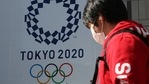 A man walks by the logo of the Tokyo Olympics, in Tokyo,(AP) A man walks by the logo of the Tokyo Olympics, in Tokyo,(AP)