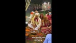 The bride and groom playing 'bottle flip' during their wedding. (Instagram/@insideoutdog_own) The bride and groom playing 'bottle flip' during their wedding. (Instagram/@insideoutdog_own)
