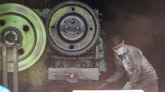 A worker busy at a factory in the Wazirpur Industrial area as lockdown curbs for industries and construction activity are eased in New Delhi on May 31. Several states and Union Territories resumed business from May 31 after weeks of lockdown caused by the unprecedented second wave of Covid-19. While some like Delhi, Madhya Pradesh and Himachal Pradesh have announced relaxations due to a decline in new cases and positivity rates, many states, including Kerala, Tamil Nadu, Maharashtra and Goa, have extended the lockdown for up to a fortnight in June.(Shahbaz Khan / PTI)