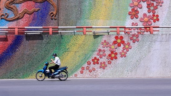 A man rides motorcycle in Hanoi, Vietnam Monday, May 31, 2021. (AP)