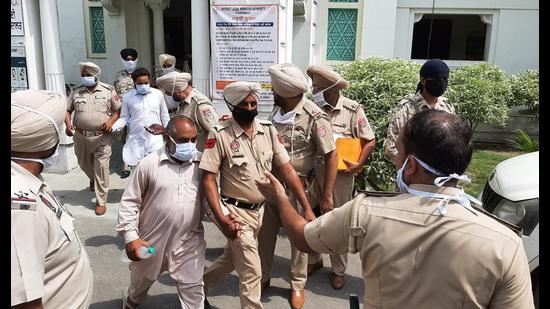 Dera followers, who were arrested in 2015 bir theft case, outside the judicial complex in Faridkot in July 2020. HT file