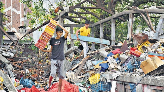 Vendors collect goods and remains on Sunday, after the PMC demolished shops at the Mahatma Phule Mandai on Saturday. (KALPESH NUKTE) Vendors collect goods and remains on Sunday, after the PMC demolished shops at the Mahatma Phule Mandai on Saturday. (KALPESH NUKTE)